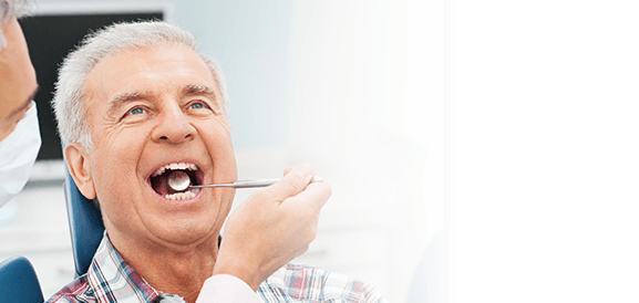 Senior man receiving a dental exam