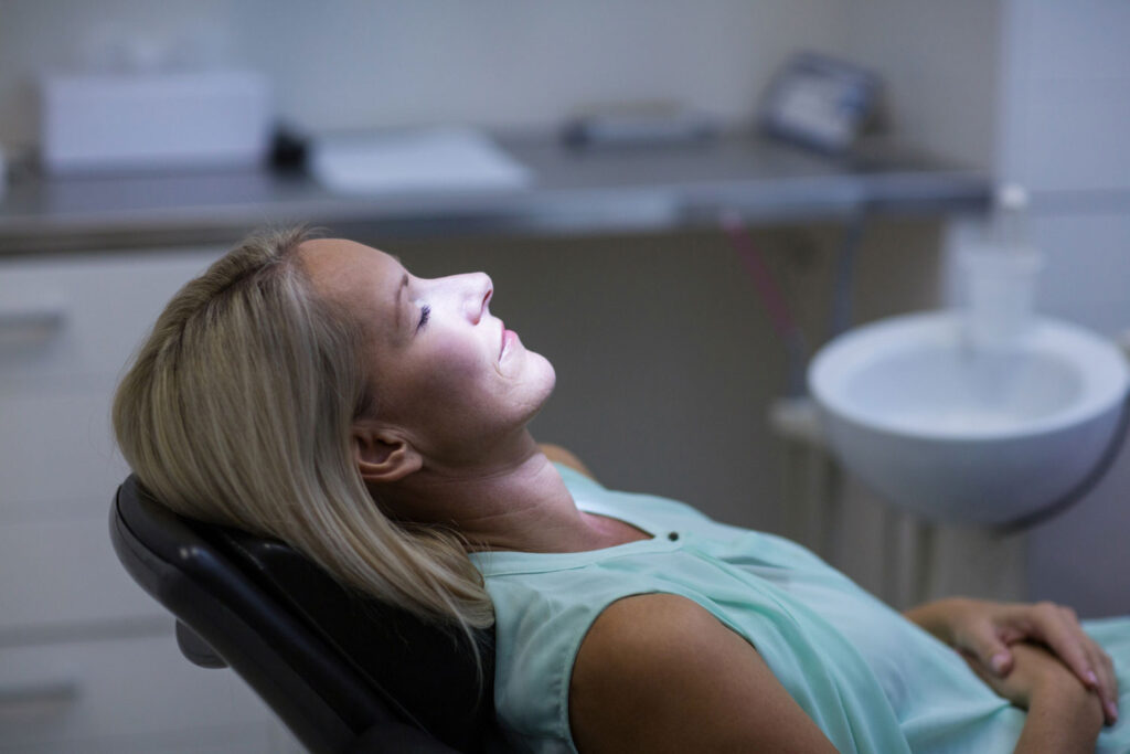 Relaxed patient receiving sedation dentistry during a dental implant procedure at Morgan Dental Care
